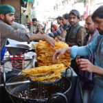 People purchasing Jalabies and other food items for Iftar at Prince Road