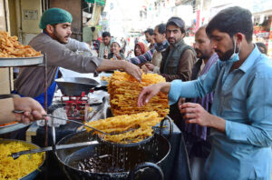 People purchasing Jalabies and other food items for Iftar at Prince Road