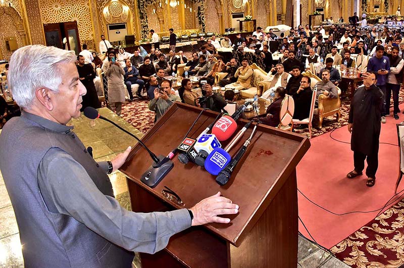 Defense Minister Khawaja Muhammad Asif addressing the welcome iftar dinner by University of Sialkot Chairman Faisal Manzoor Malik