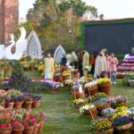 A large number of families stroll through the colorful flowers during the various flower on display organized by the PHA at Jilani Park