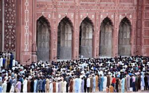 People offer Friday prayers during the Islamic holy fasting month of Ramadan in Historical Badshahi Mosque.