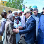 Prime Minister Muhammad Shehbaz Sharif consoling the affectees of torrential rains at a relief camp