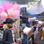 A street hawker selling cotton candy at G-9 Markaz