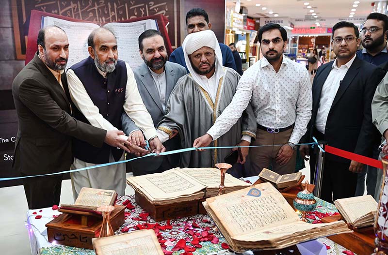 Chairman of the Council of Islamic Ideology (CII) Dr. Qibla Ayaz along with others cutting ribbon at the opening ceremony of Quran Exhibition of Manuscripts organized by Cultural Consulate Embassy of I.R.Iran Islamabad and Iran Pakistan Institute of Persian Studies in collaboration with Safa Gold Mall