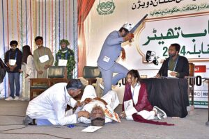Artists performing on the stage during a drama titled "Murad Kya Hai" by Azhar Lakha during the 1st Punjab Theater Competition 2024 in collaboration with Punjab Arts Council