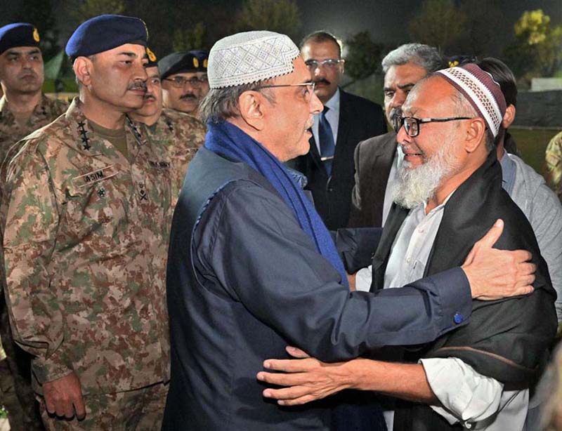 Chief of the Army Staff General Syed Asim Munir and President of Pakistan Asif Ali Zardari pays condolence to martyrs family after Funeral prayers of Lieutenant Colonel Syed Kashif Ali Shaheed (age: 39 years, resident of Karachi) and Captain Muhammad Ahmed Badar Shahed (age: 23 years, resident of District Talagang) who embraced martyrdom while defending their motherland against the scourge of terrorism in Mir Ali, North Waziristan District, were offered at Chaklala Garrison