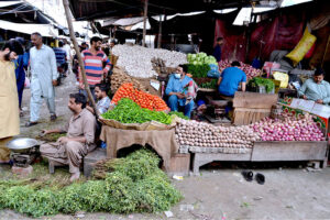 People purchasing vegetables in a Ramadan Sasta Bazar