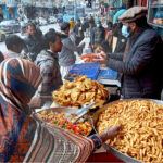 A vendor selling fritter food for Iftari in the Holy Month of Ramazan
