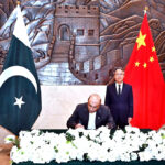 President Asif Ali Zardari registering his condolence remarks in the visitor's book, at the Chinese Embassy