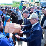 Prime Minister Muhammad Shehbaz Sharif distributes relief items among the affectees of torrential rains
