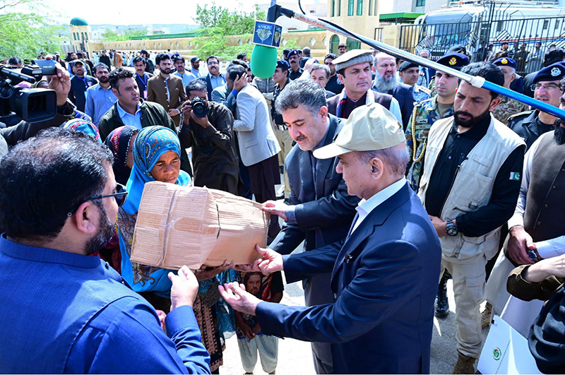 Prime Minister Muhammad Shehbaz Sharif distributes relief items among the affectees of torrential rains