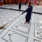 Volunteers cleaning Karachi's oldest new Memon Mosque ahead of holy month of Ramazan