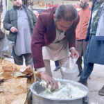 A vendor selling pure butter stored in bark shell on the road side during the 1st day of holy Month of Ramazan