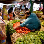 People purchasing vegetables in a Ramadan Sasta Bazar