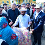 Prime Minister Muhammad Shehbaz Sharif distributes relief items among the affectees of torrential rains
