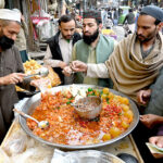 A vendor selling traditional sweet item Murabba to attract the customers during Ramadan