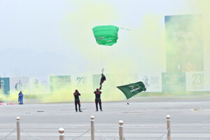 Pakistan Army paratroopers showing their skills, participate in Pakistan Day 2024 parade ceremony, at Shakarparian Parade Ground