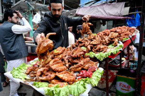 A vendor selling traditional sweet item Murabba to attract the customers during Ramadan