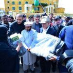 Prime Minister Muhammad Shehbaz Sharif distributes relief items among the affectees of torrential rains