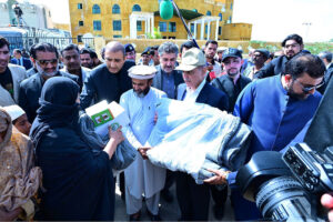Prime Minister Muhammad Shehbaz Sharif distributes relief items among the affectees of torrential rains