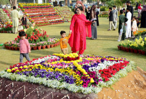 Families visiting flowers exhibition during the flowers show at Cantt Park