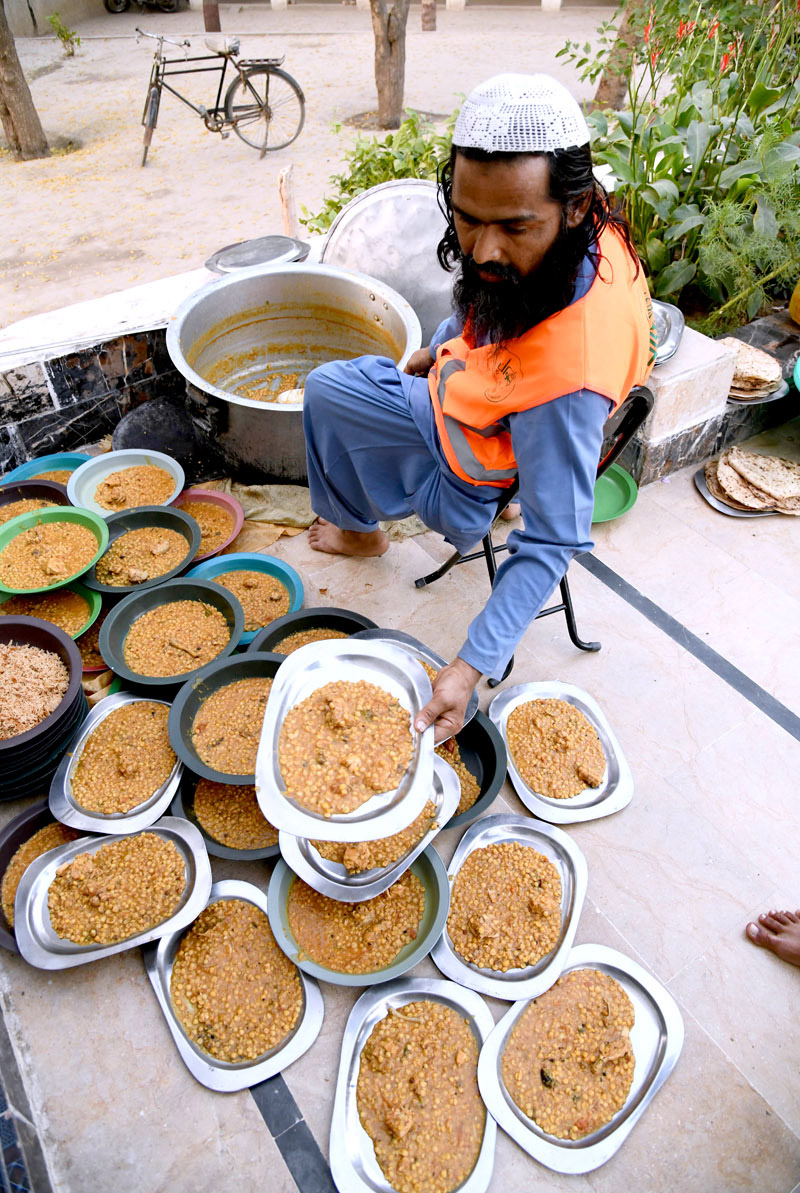 A large number of people breaking fast (Iftar) in the holy month of Ramzan ul Mubarak at a local Masjid