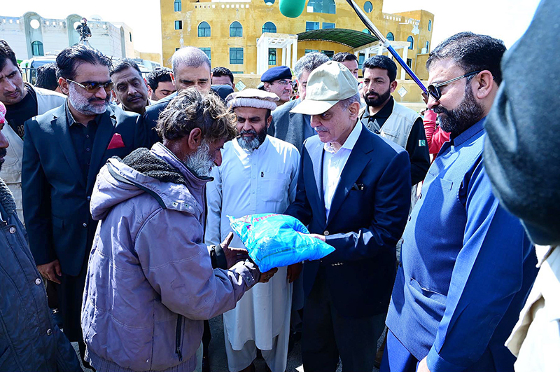 Prime Minister Muhammad Shehbaz Sharif distributes relief items among the affectees of torrential rains