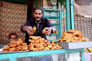 People purchasing Dates from a vendor at Meezan Chowk