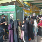 A large number of women in queue to get fruits and vegetables for just Rs.10 per Kg in Ramazan-ur-Mubarak organized by Hammad Foundation Pakistan camp at Hasan Square area