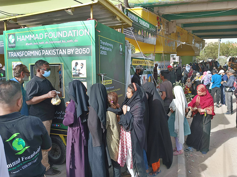 A large number of women in queue to get fruits and vegetables for just Rs.10 per Kg in Ramazan-ur-Mubarak organized by Hammad Foundation Pakistan camp at Hasan Square area