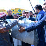 Prime Minister Muhammad Shehbaz Sharif distributes relief items among the affectees of torrential rains