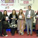 A group photo of the awards winners and panelists of the CSR for Women Development Conference