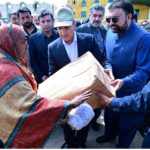 Prime Minister Muhammad Shehbaz Sharif distributes relief items among the affectees of torrential rains