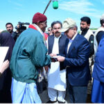 Prime Minister Muhammad Shehbaz Sharif distributes relief items among the affectees of torrential rains