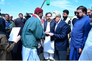 Prime Minister Muhammad Shehbaz Sharif distributes relief items among the affectees of torrential rains