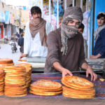Vendor decorates Roghni Naan to attract customers at Chaman Phatak