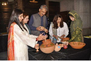 On the occasion of Punjabi Cultural Day, women looking at the traditional dishes of Punjab at the stall in Lahore Museum.