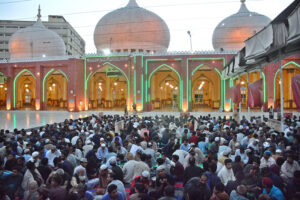 Volunteers distributing food among people during Iftari at New Memon Masjid on the first day of Ramzan