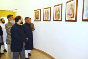 Federal Ombudsman for Tax Dr. Asif Mahmood Jah, watching photographs at Bahawalpur Chamber of Commerce and Industry
