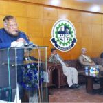 Federal Ombudsman for Tax Dr. Asif Mahmood Jah, watching photographs at Bahawalpur Chamber of Commerce and Industry