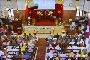 Christian community members performing religious rituals on Good Friday Day at Sun Church.