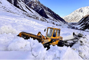 Heavy machineries being used to remove snow from the blocked road of Mir Malik area Astore Valley by the staffer of Gilgit-Baltistan Disaster Management Authority as the last heavy snow fall and rain hit the area and caused land sliding