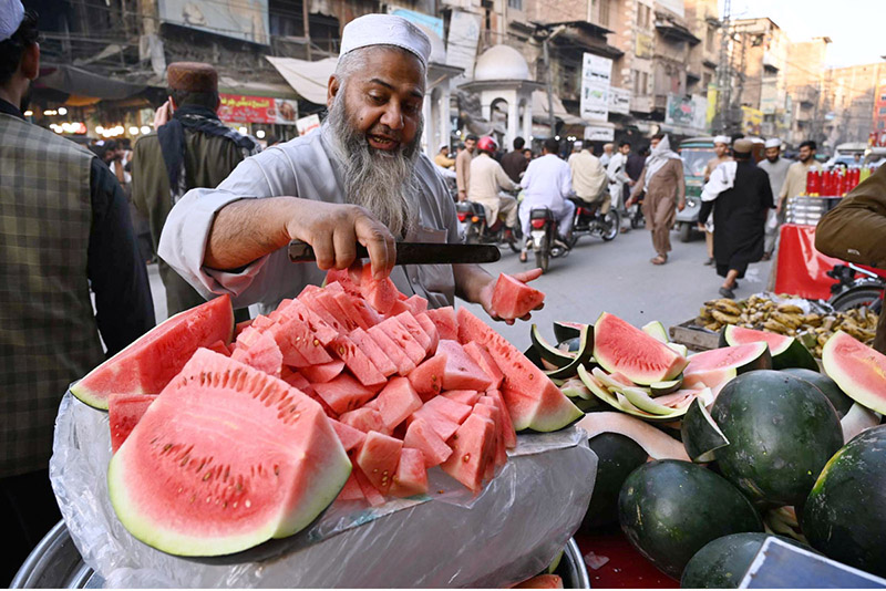 Vendor selling and displaying watermelon to attract the customers near Mohallah Jhangi