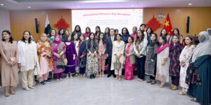 Consul General of the People's Republic of China in Karachi Mr. Yang Yundong cutting cake during International Women’s Day celebration ceremony at Consulate General of China.