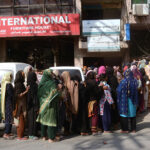 Women in long queues at Davies Road to receive cash payment of BISE programm