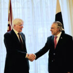 Foreign Minister Mohammad Ishaq Dar shakes hand with UK Minister of State for Development, Andrew Mitchell at the Foreign Commonwealth and Development Office