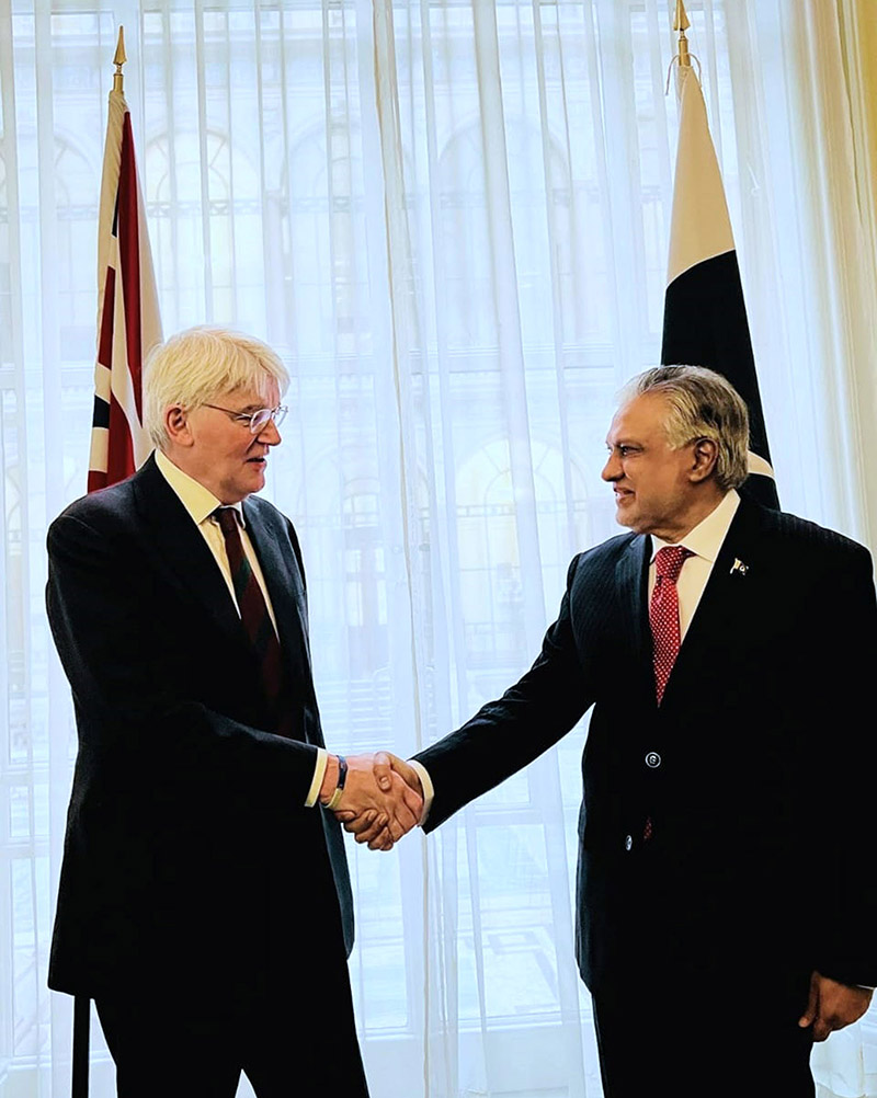 Foreign Minister Mohammad Ishaq Dar shakes hand with UK Minister of State for Development, Andrew Mitchell at the Foreign Commonwealth and Development Office