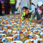 Volunteers organize Iftar for fasting people at road side during the holy month of Ramazan ul Mubarak at Latifabad