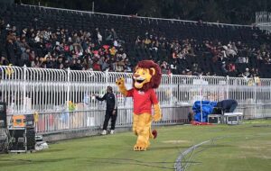 A person with lion costume entertain the spectators watching T20 cricket match between Islamabad United and Peshawar Zalmi teams during Pakistan Super League (PSL) season nine at Rawalpindi Cricket Stadium