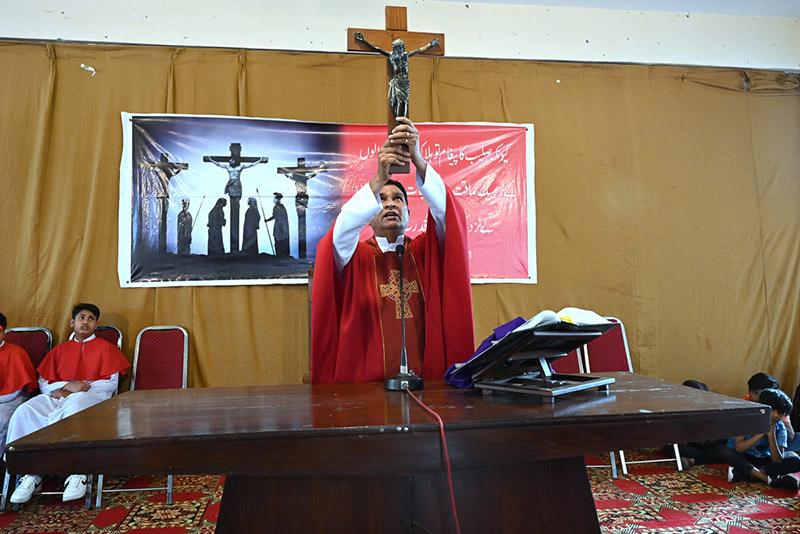 Bishop of Fatima Church performing religious rituals on Good Friday Day.